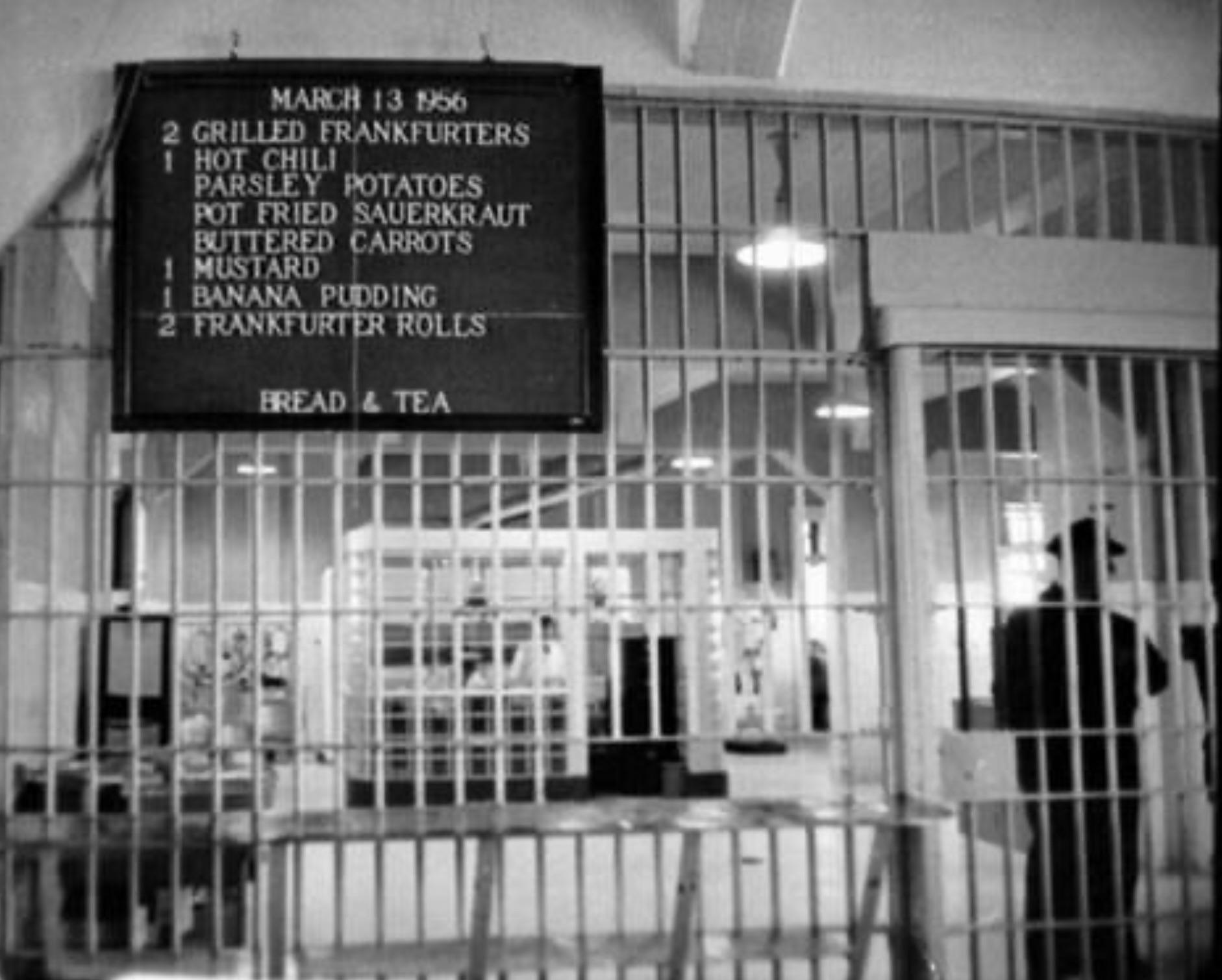A blackboard lists the menu of the dining hall at Alcatraz in 1956.